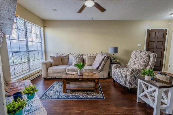 a living room with furniture and a rug