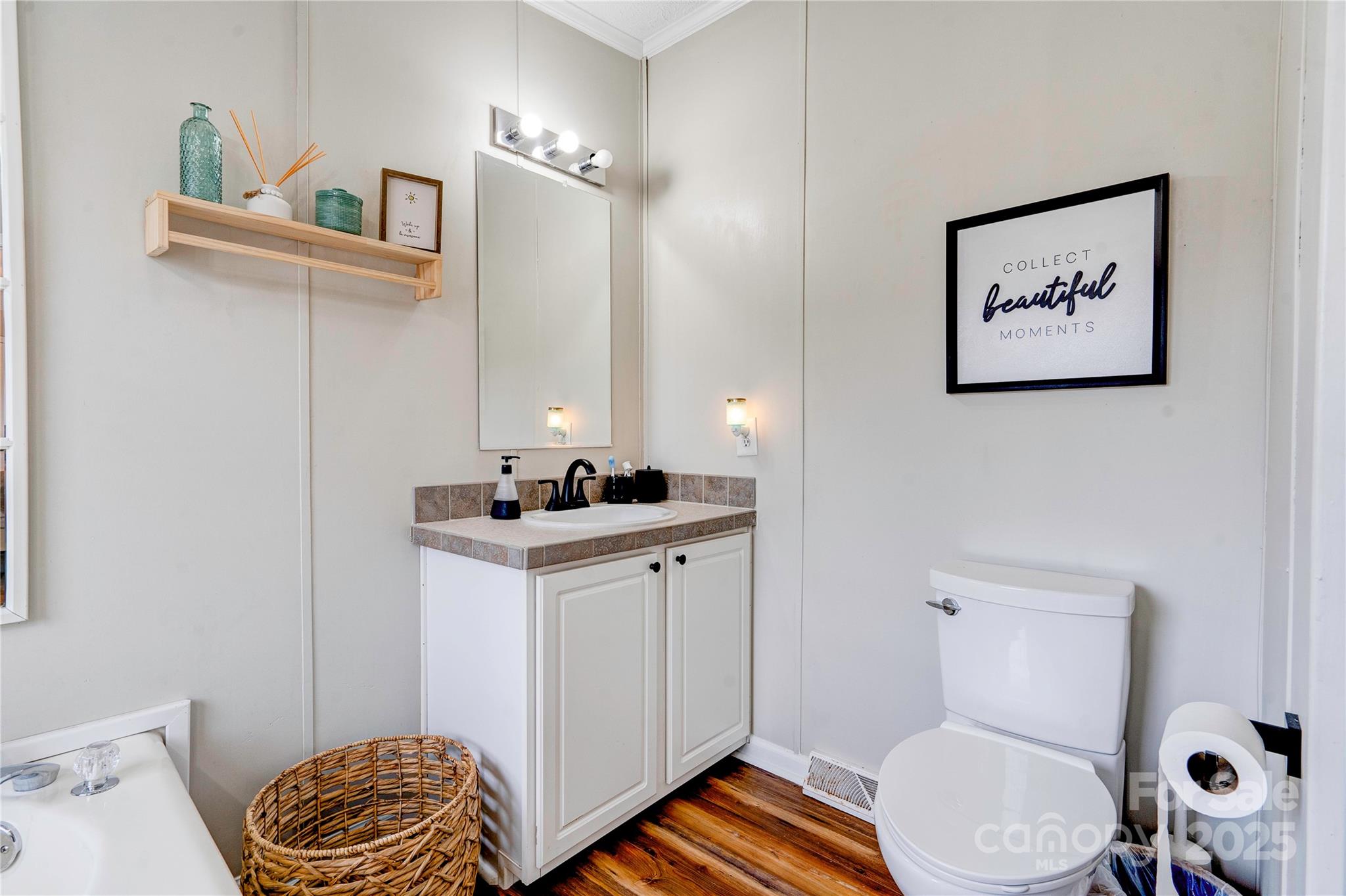 2002 Bachelor Road Mooresboro, NC 28114 - Photo 15 of 30 a bathroom with a toilet a sink and mirror