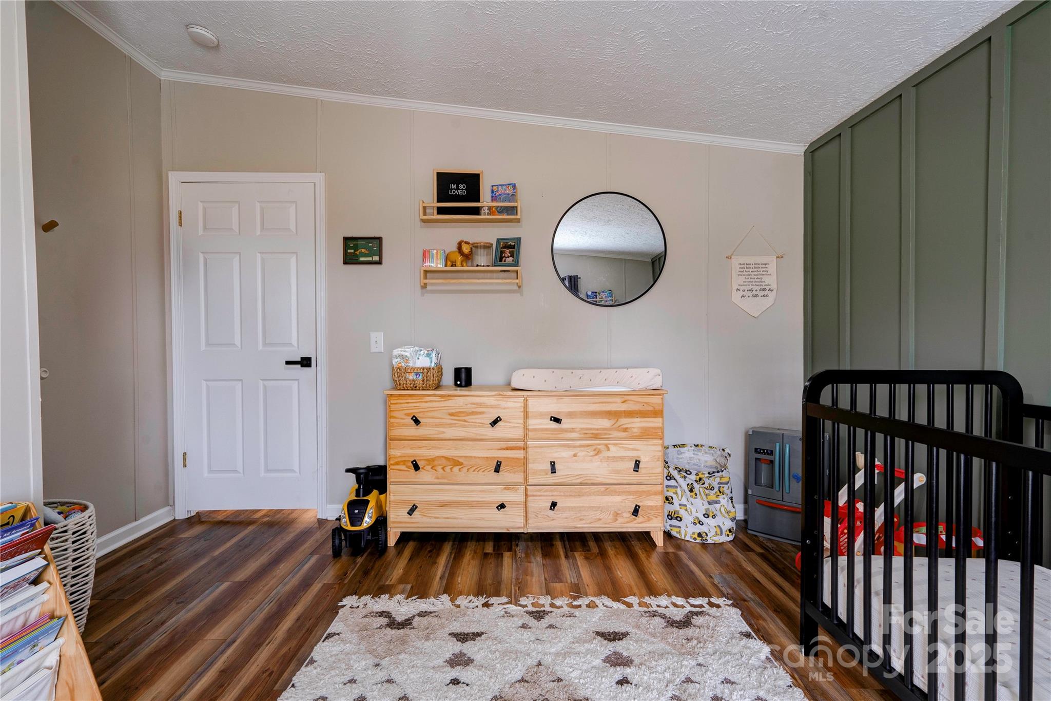 2002 Bachelor Road Mooresboro, NC 28114 - Photo 20 of 30 a bedroom with a bed and wooden floor