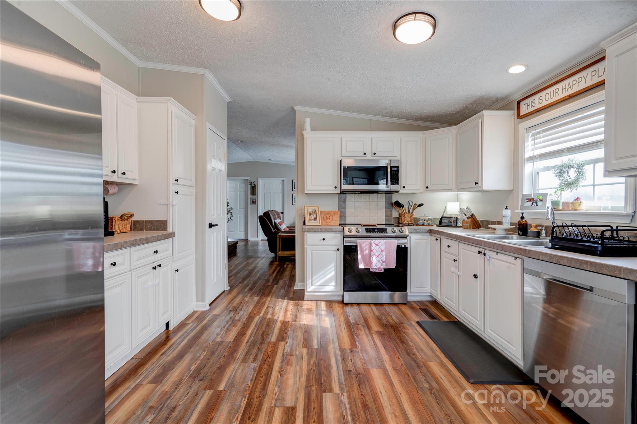 2002 Bachelor Road Mooresboro, NC 28114 - Photo 3 of 30 a kitchen with cabinets a sink and appliances
