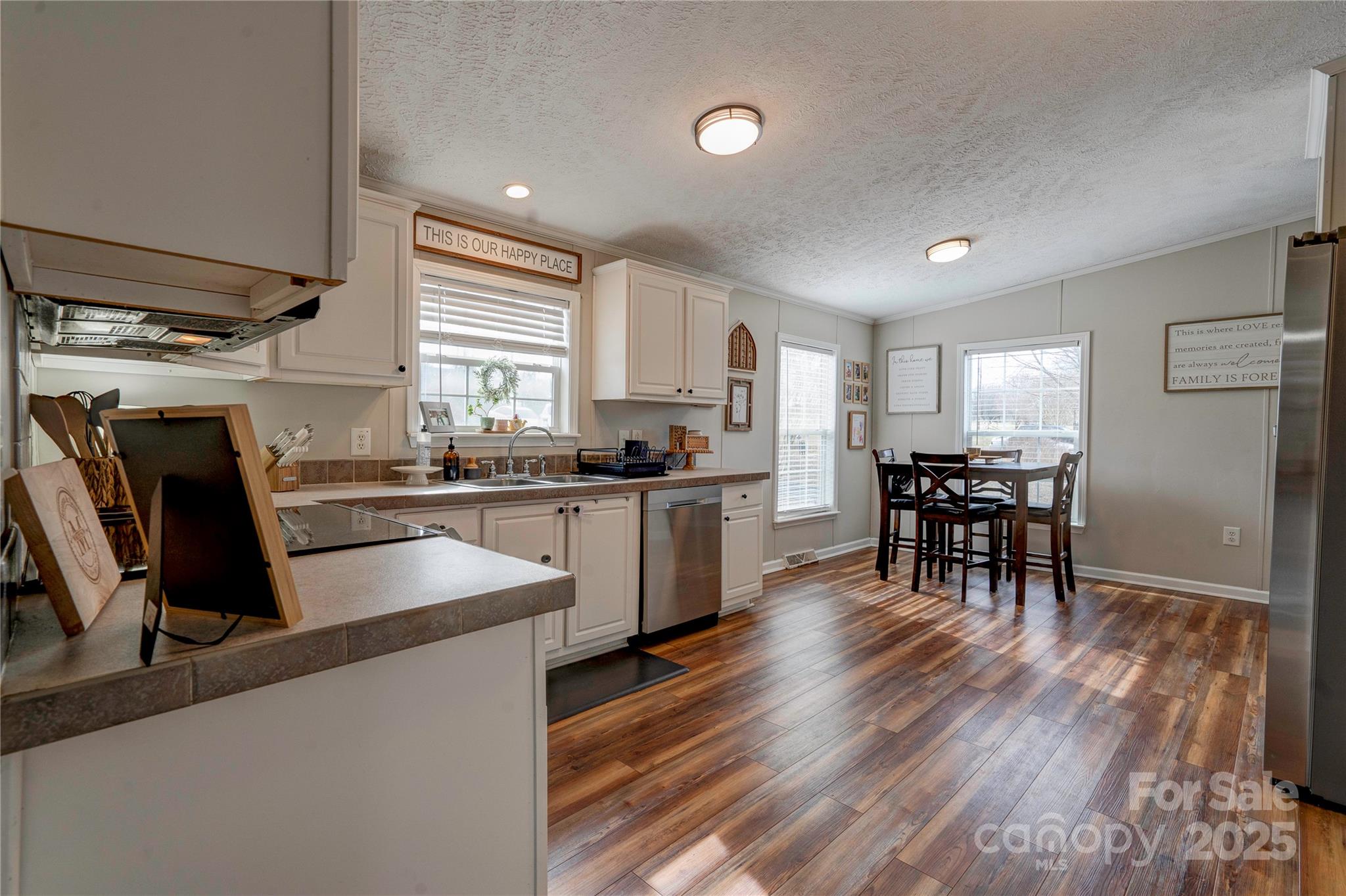 2002 Bachelor Road Mooresboro, NC 28114 - Photo 6 of 30 a kitchen with granite countertop cabinets a dining table and appliances