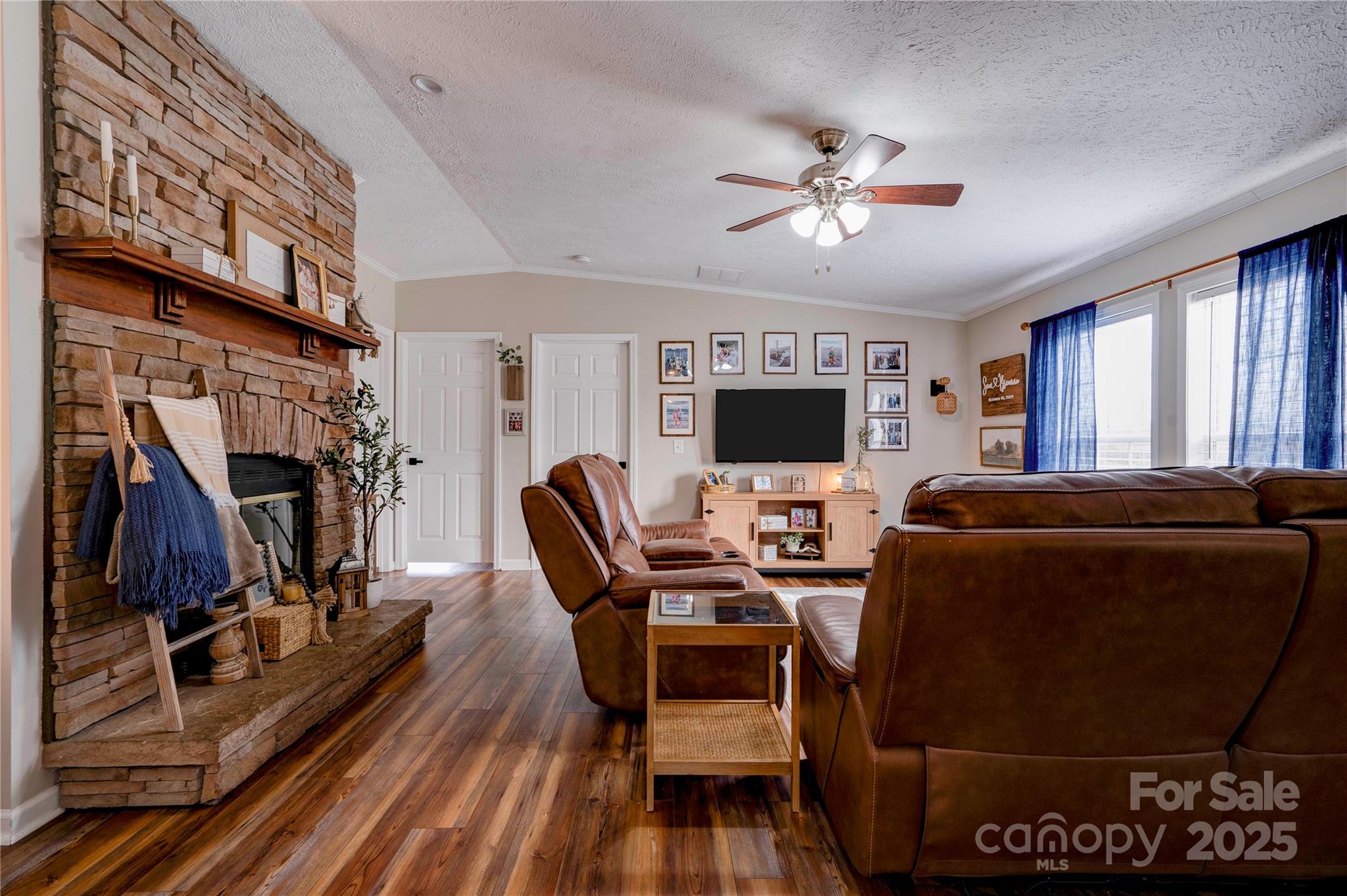 2002 Bachelor Road Mooresboro, NC 28114 - Photo 7 of 30 a view of a livingroom with furniture and a ceiling fan