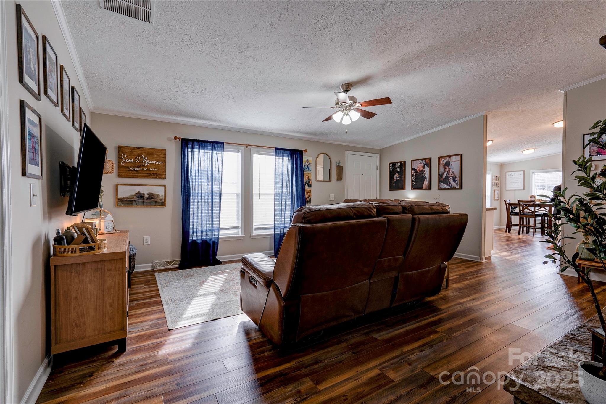 2002 Bachelor Road Mooresboro, NC 28114 - Photo 9 of 30 a living room with furniture and a flat screen tv