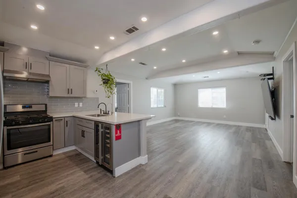 a kitchen with a stove and a sink