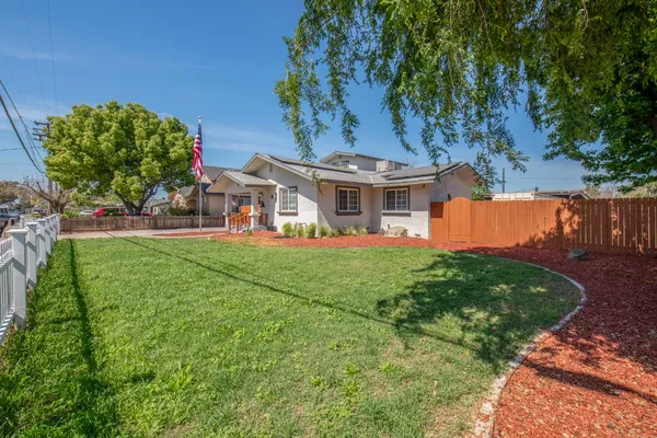front view of a house with a big yard