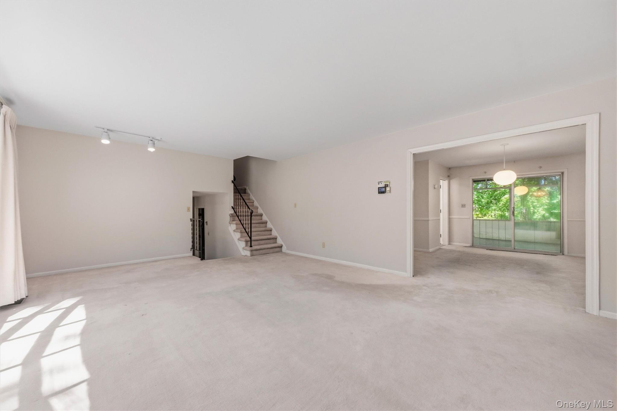 75 Pleasant Ridge Drive Poughkeepsie, NY 12603 - Photo 8 of 47 Expansive formal living room with large bow window and wood burning fireplace. Hardwood under carpet.