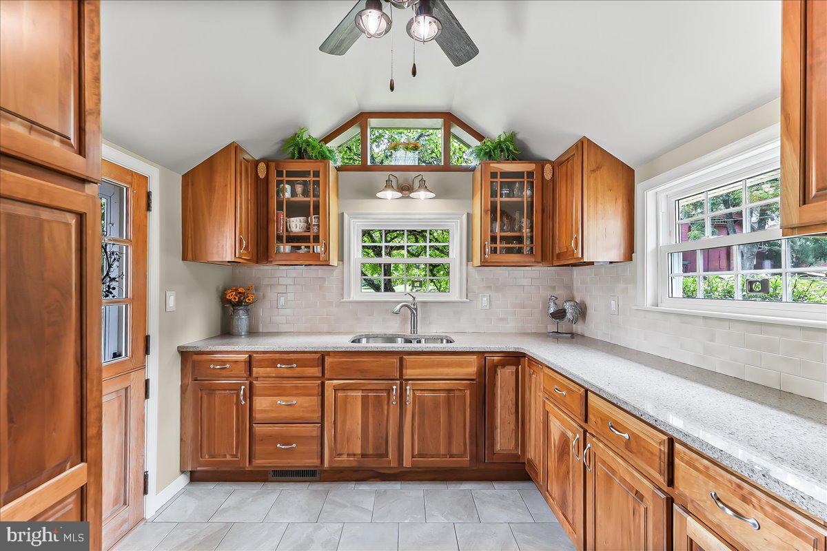 1439 Middletown Road Glen Mills, PA 19342 - Photo 12 of 45 a kitchen with a sink window and cabinets