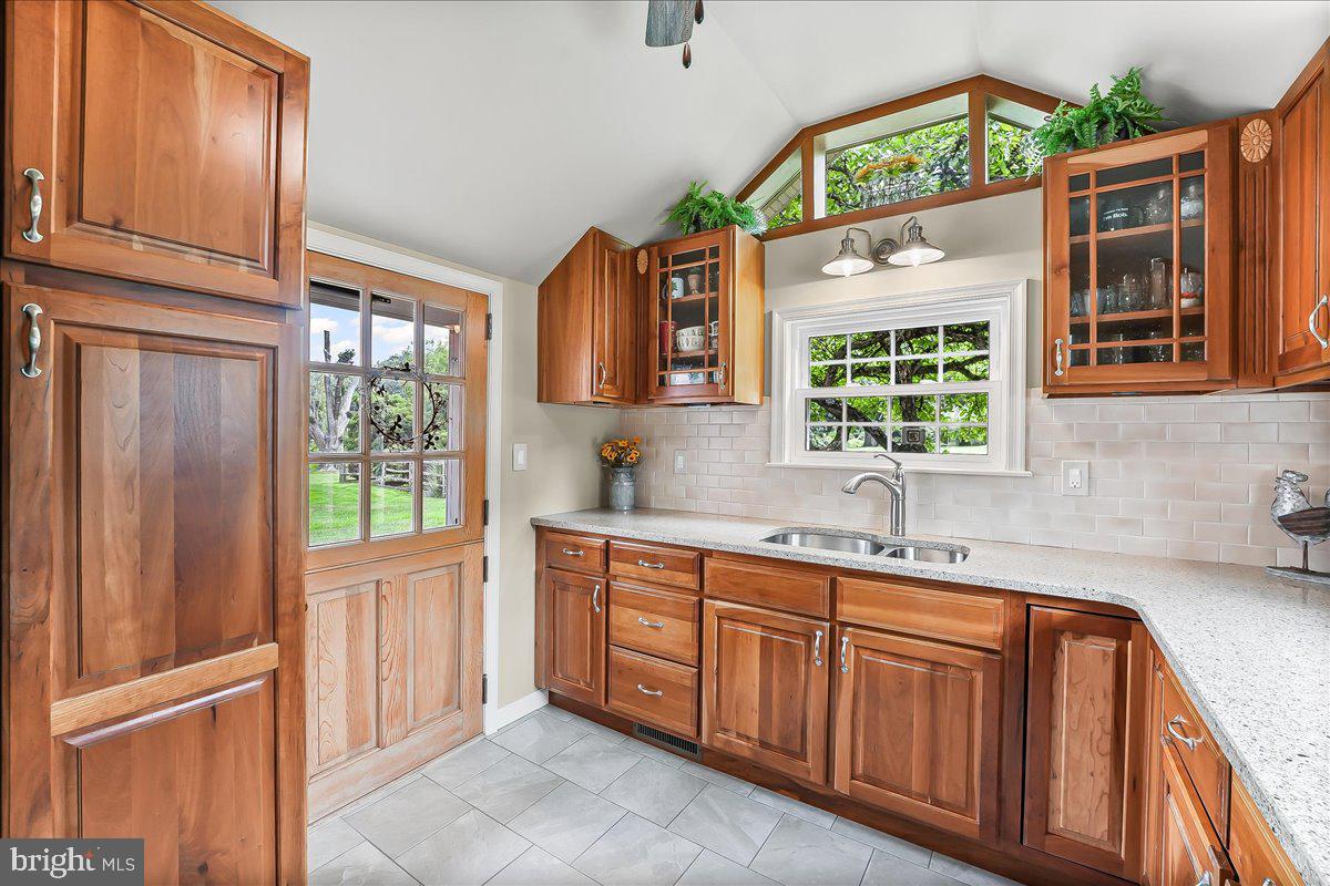 1439 Middletown Road Glen Mills, PA 19342 - Photo 14 of 45 a kitchen with stainless steel appliances granite countertop wooden cabinets a sink and a window