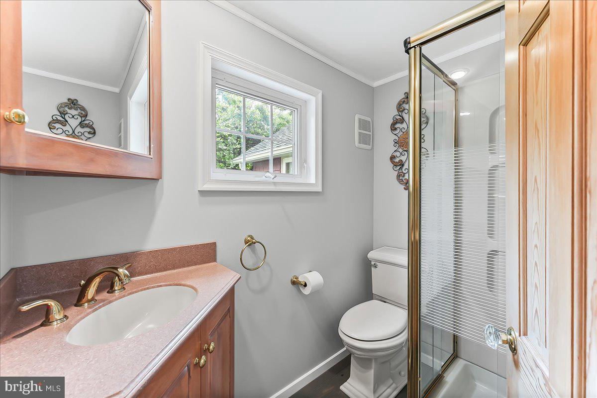1439 Middletown Road Glen Mills, PA 19342 - Photo 18 of 45 a bathroom with a granite countertop toilet sink and mirror