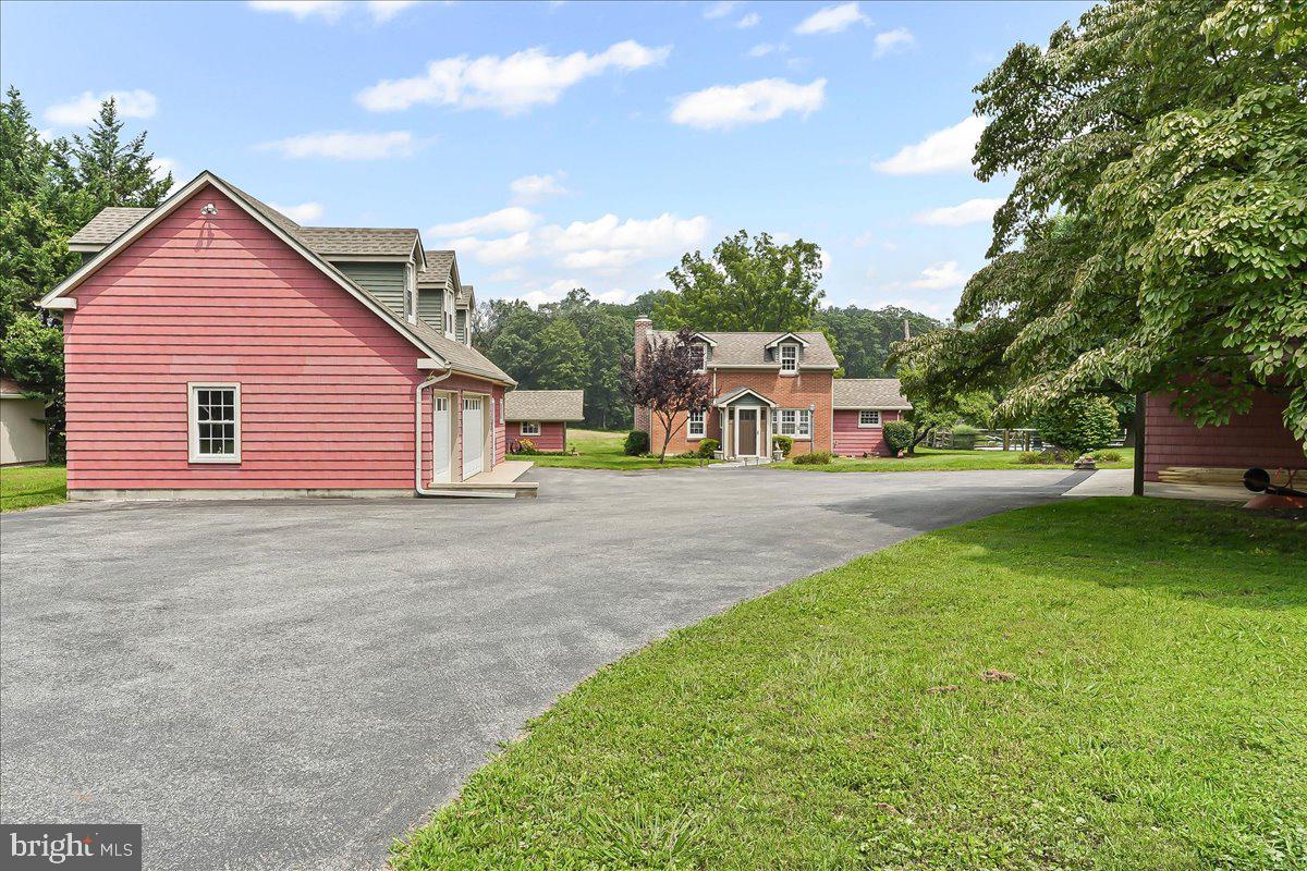 1439 Middletown Road Glen Mills, PA 19342 - Photo 2 of 45 a house view with a garden space