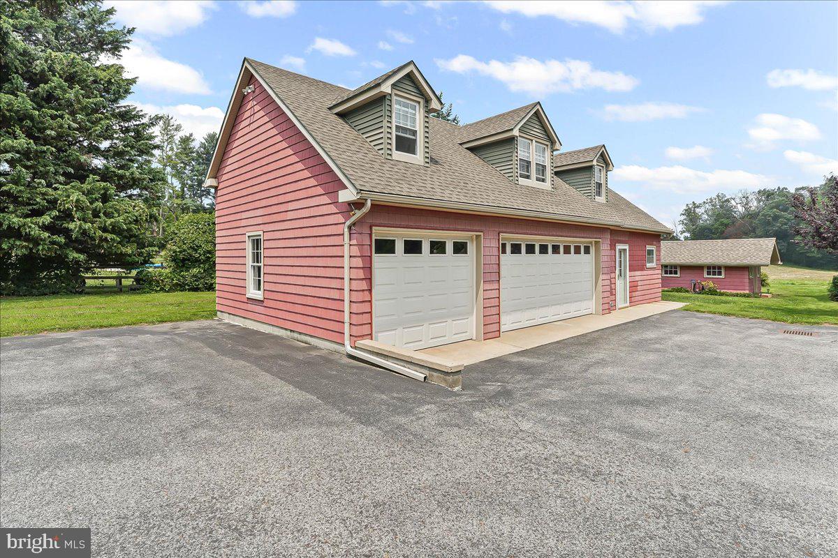 1439 Middletown Road Glen Mills, PA 19342 - Photo 33 of 45 a view of a house with a yard and garage