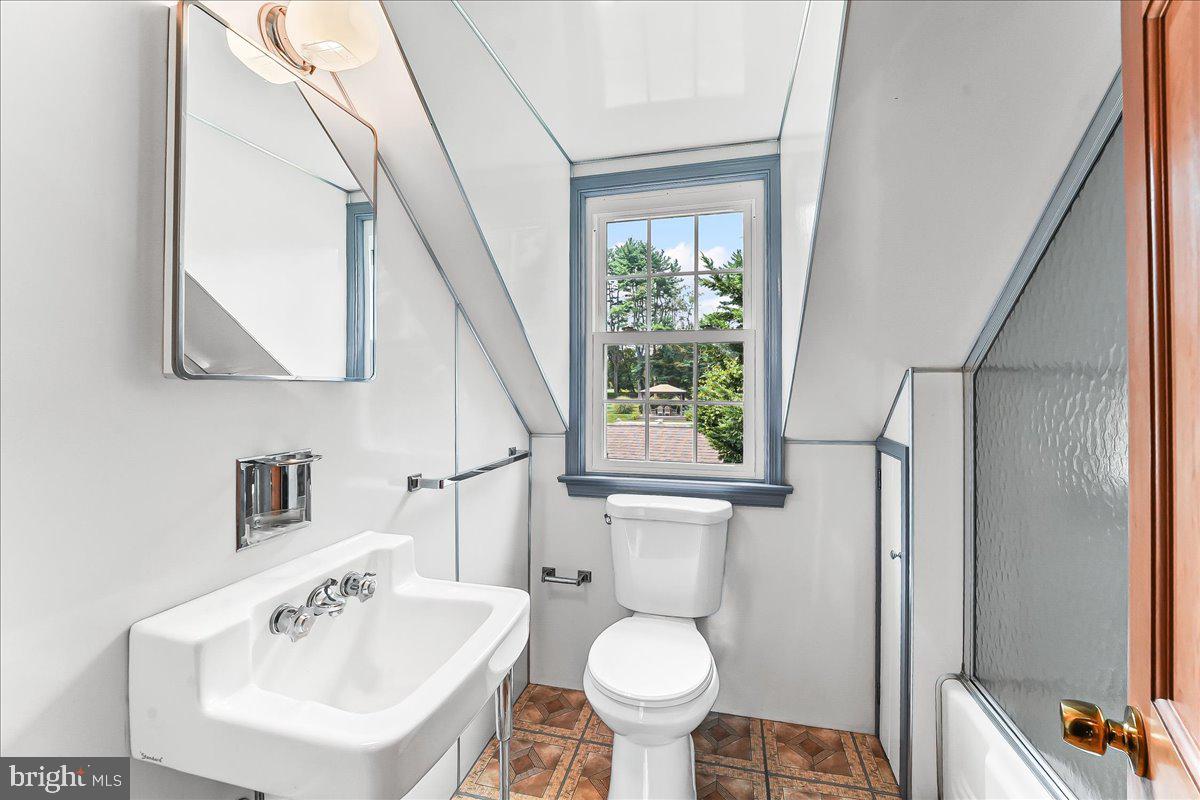 1439 Middletown Road Glen Mills, PA 19342 - Photo 37 of 45 a bathroom with a sink toilet and a mirror