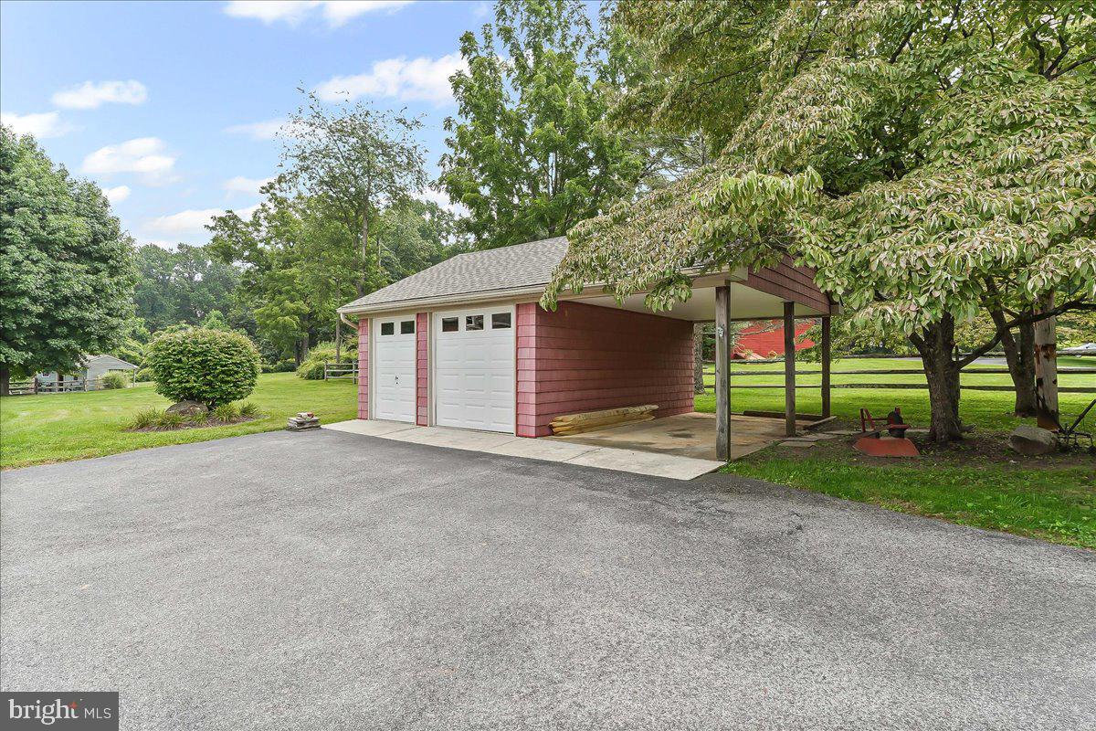 1439 Middletown Road Glen Mills, PA 19342 - Photo 38 of 45 a view of a house with a yard and garage