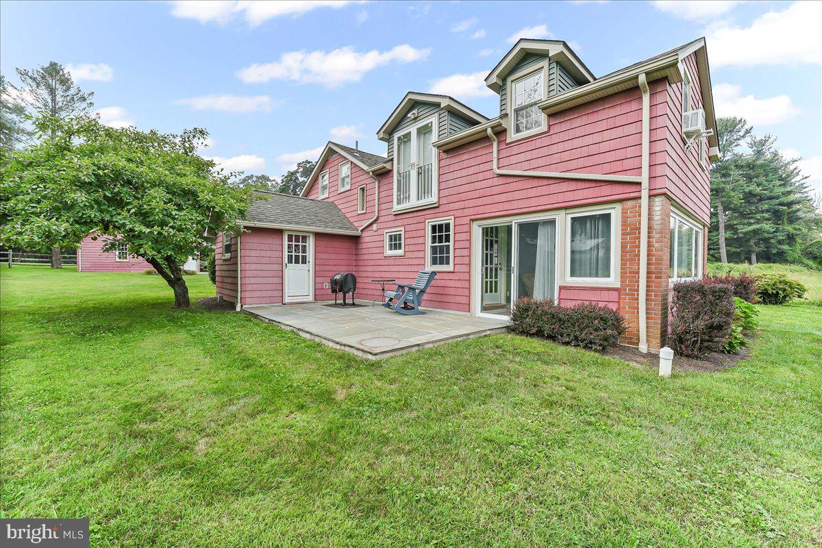 1439 Middletown Road Glen Mills, PA 19342 - Photo 43 of 45 a front view of a house with a garden and plants