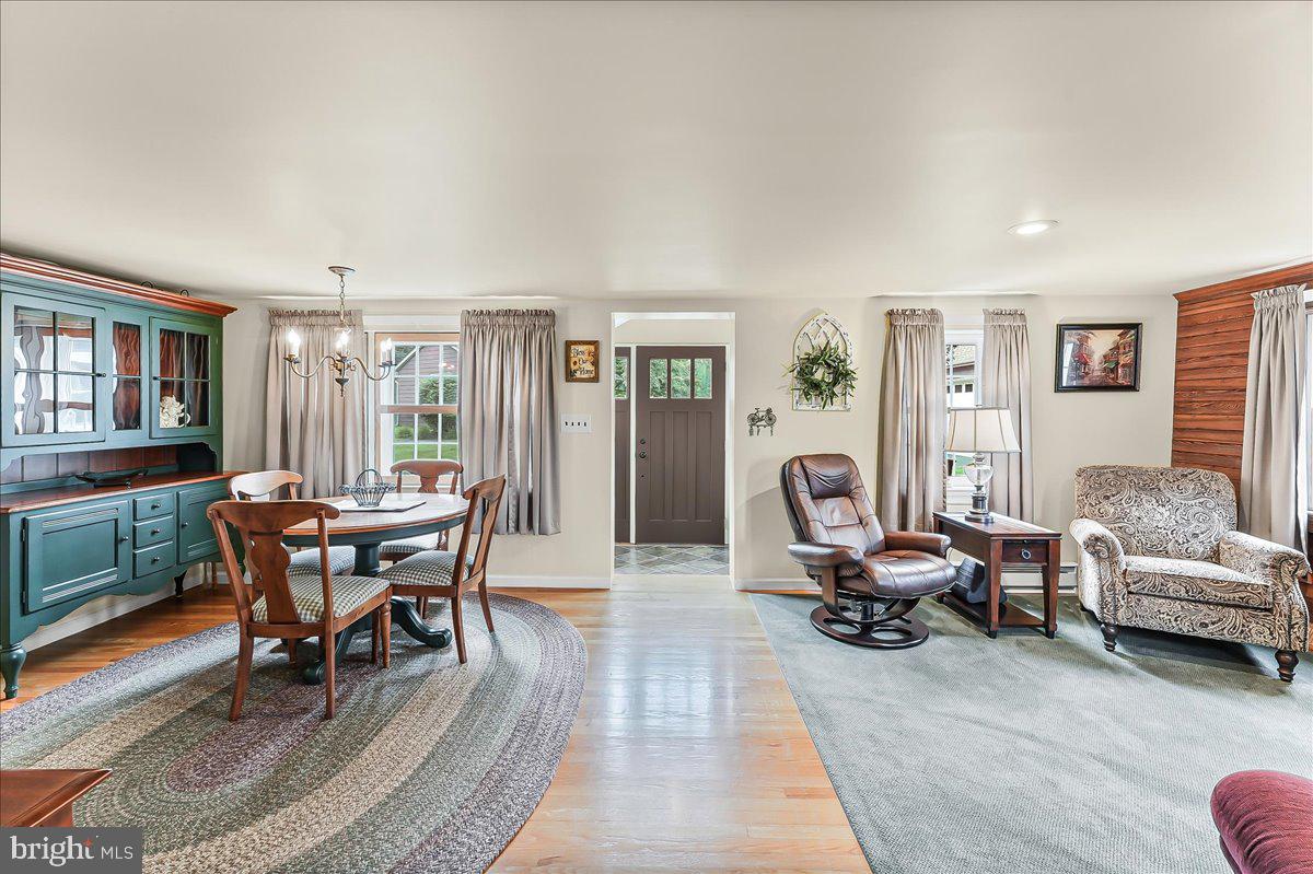 1439 Middletown Road Glen Mills, PA 19342 - Photo 5 of 45 a living room with furniture a wooden floor and next to a window