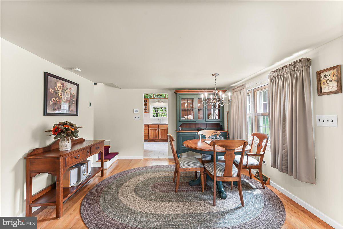 1439 Middletown Road Glen Mills, PA 19342 - Photo 8 of 45 a dining room with furniture a rug and a large window