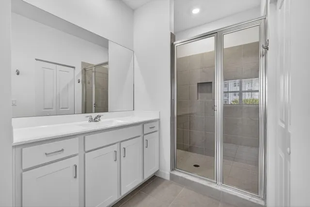 a bathroom with a double vanity sink and mirror