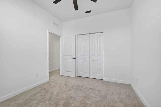 an empty room with fan