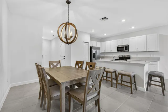 a view of kitchen with sink and microwave