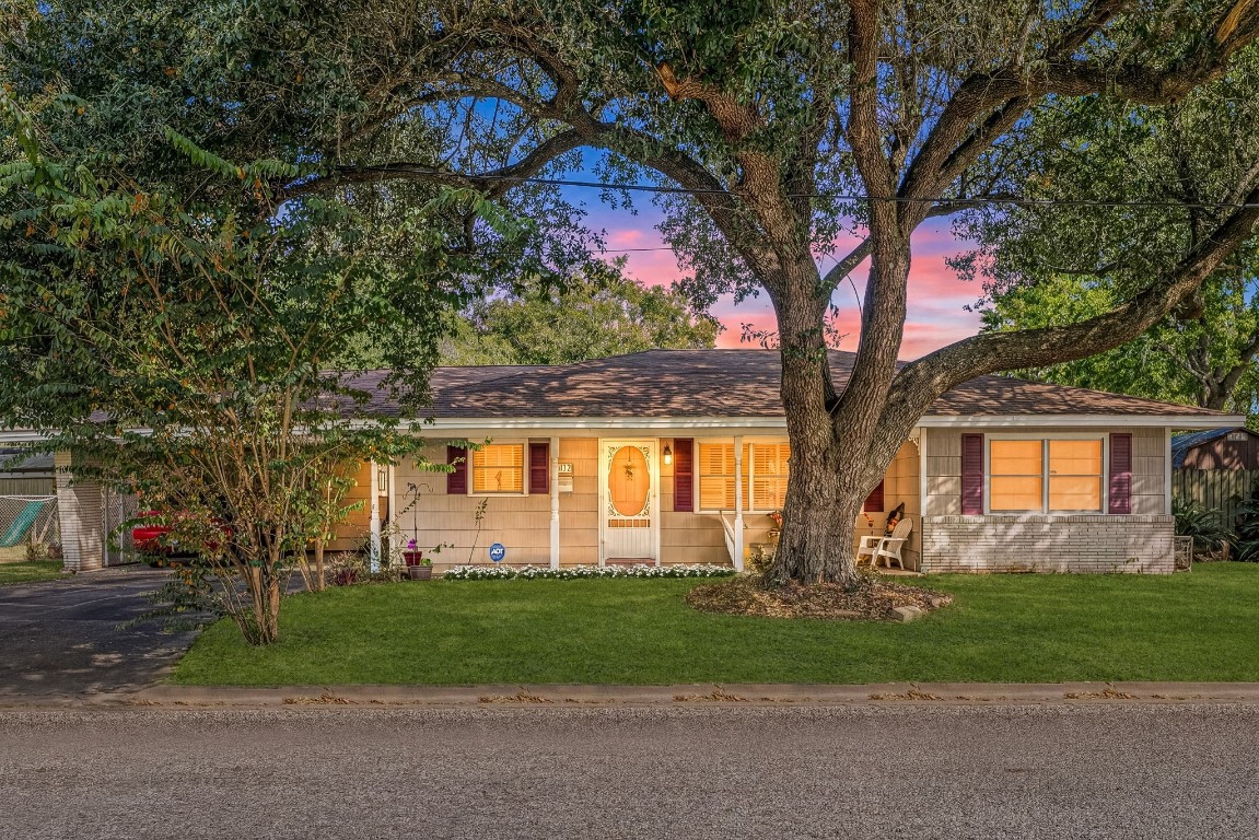 1811 Myrtle Street Liberty, TX 77575 - Photo 17 of 18 a front view of a house with garden