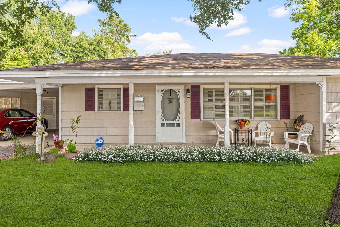 1811 Myrtle Street Liberty, TX 77575 - Photo 18 of 18 a front view of a house with garden