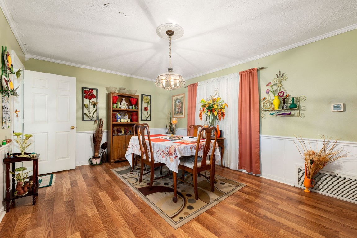 1811 Myrtle Street Liberty, TX 77575 - Photo 4 of 18 a view of a dining room with furniture window and wooden floor
