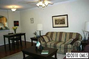 905 Copperstone Lane Fort Mill, SC 29708 - Photo 5 of 8 a view of a dining room with furniture and wooden floor