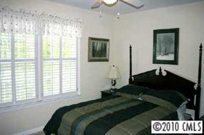 905 Copperstone Lane Fort Mill, SC 29708 - Photo 7 of 8 a bedroom with a bed and a window
