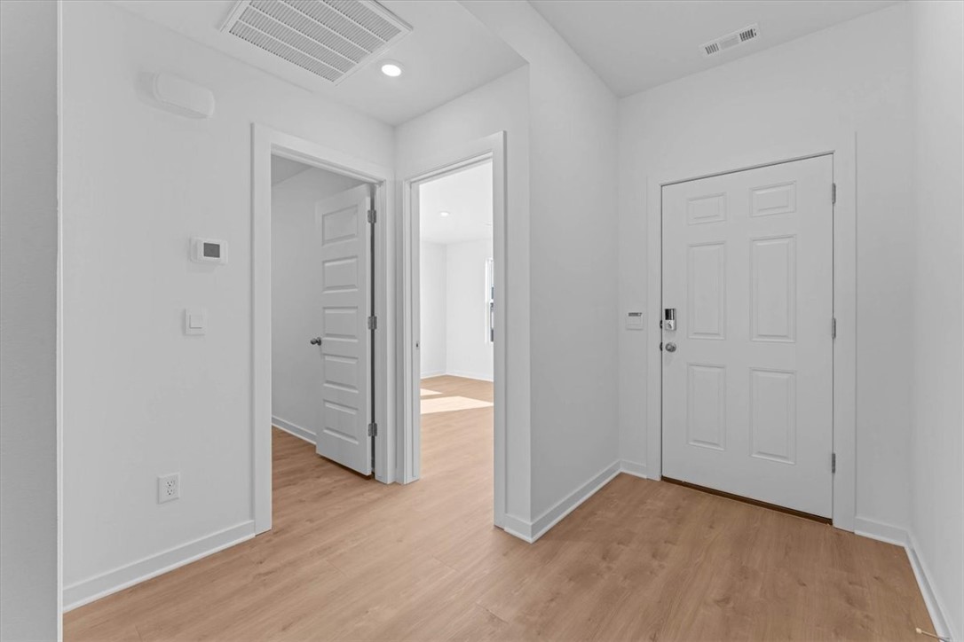 550 Riggs Street Prairie Grove, AR 72753 - Photo 6 of 29 White paneled entry door with smart lock