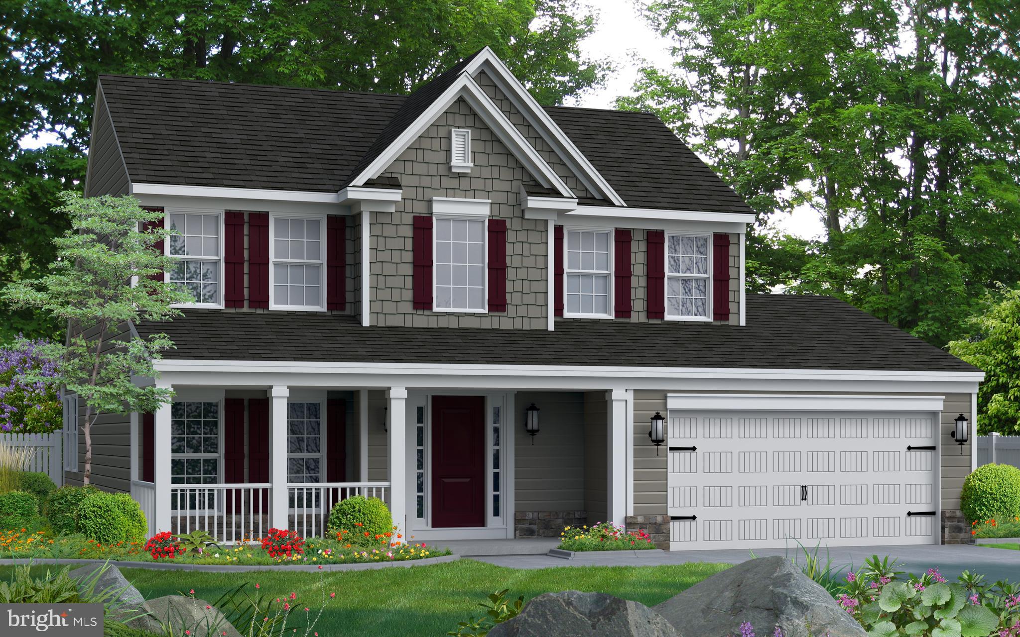 a view of a white house with large windows and a yard