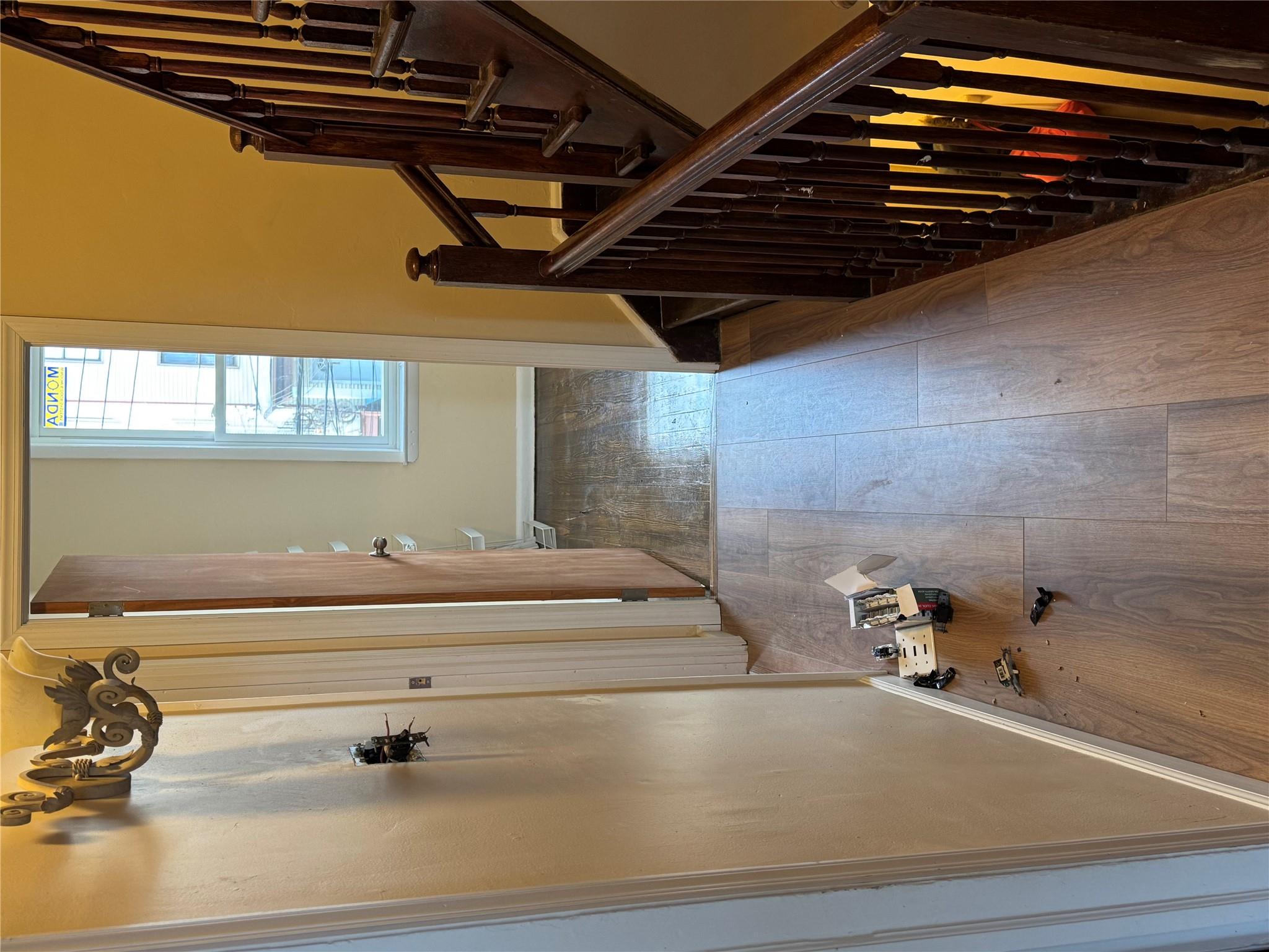 776 Hewitt Place Bronx, NY 10455 - Photo 15 of 20 a view of a hallway with wooden floor and staircase