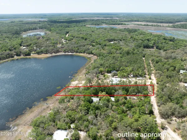 a view of a lake with a yard