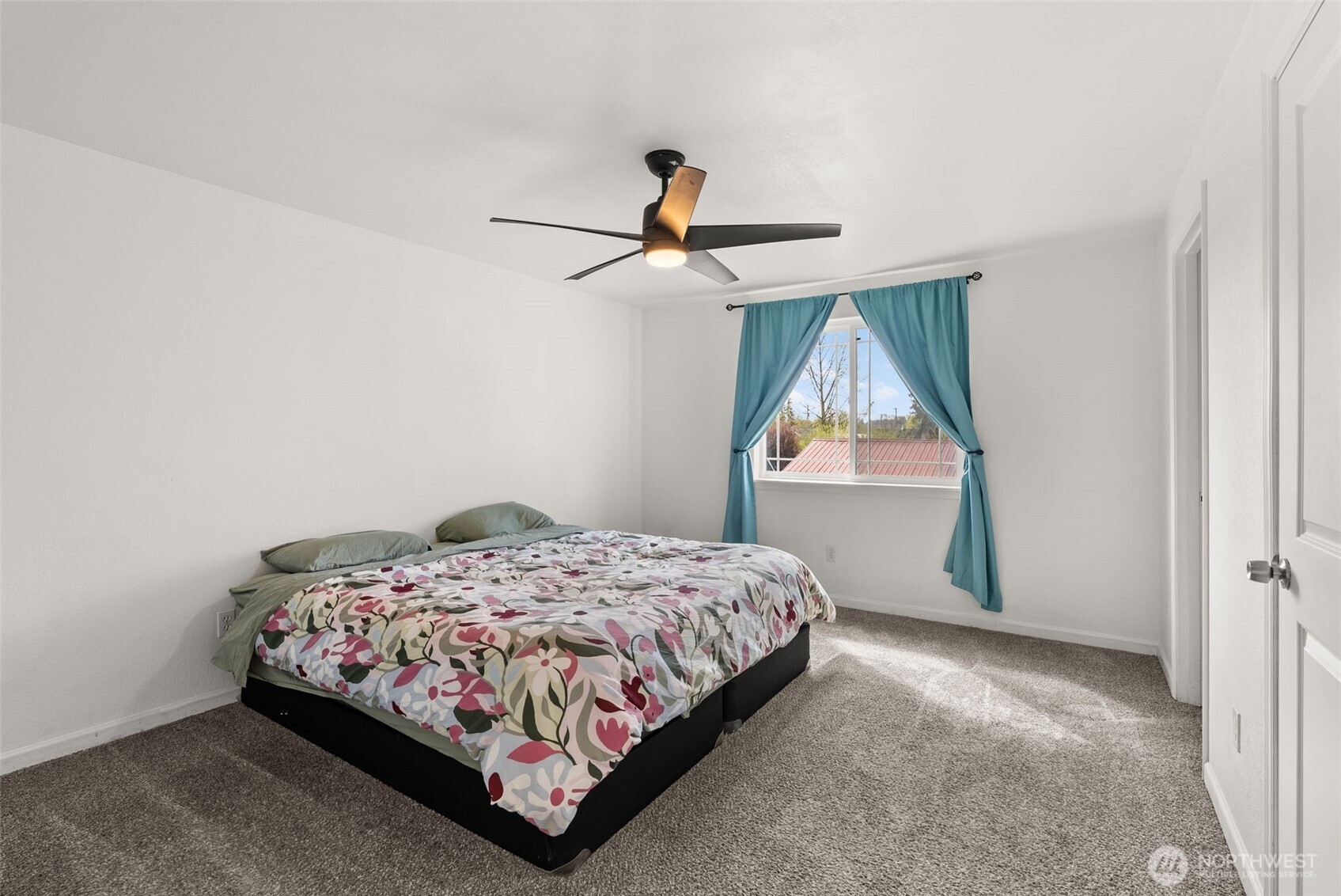 1231 Southwest Elzina Street Chehalis, WA 98532 - Photo 15 of 24 a bedroom with a bed and a window