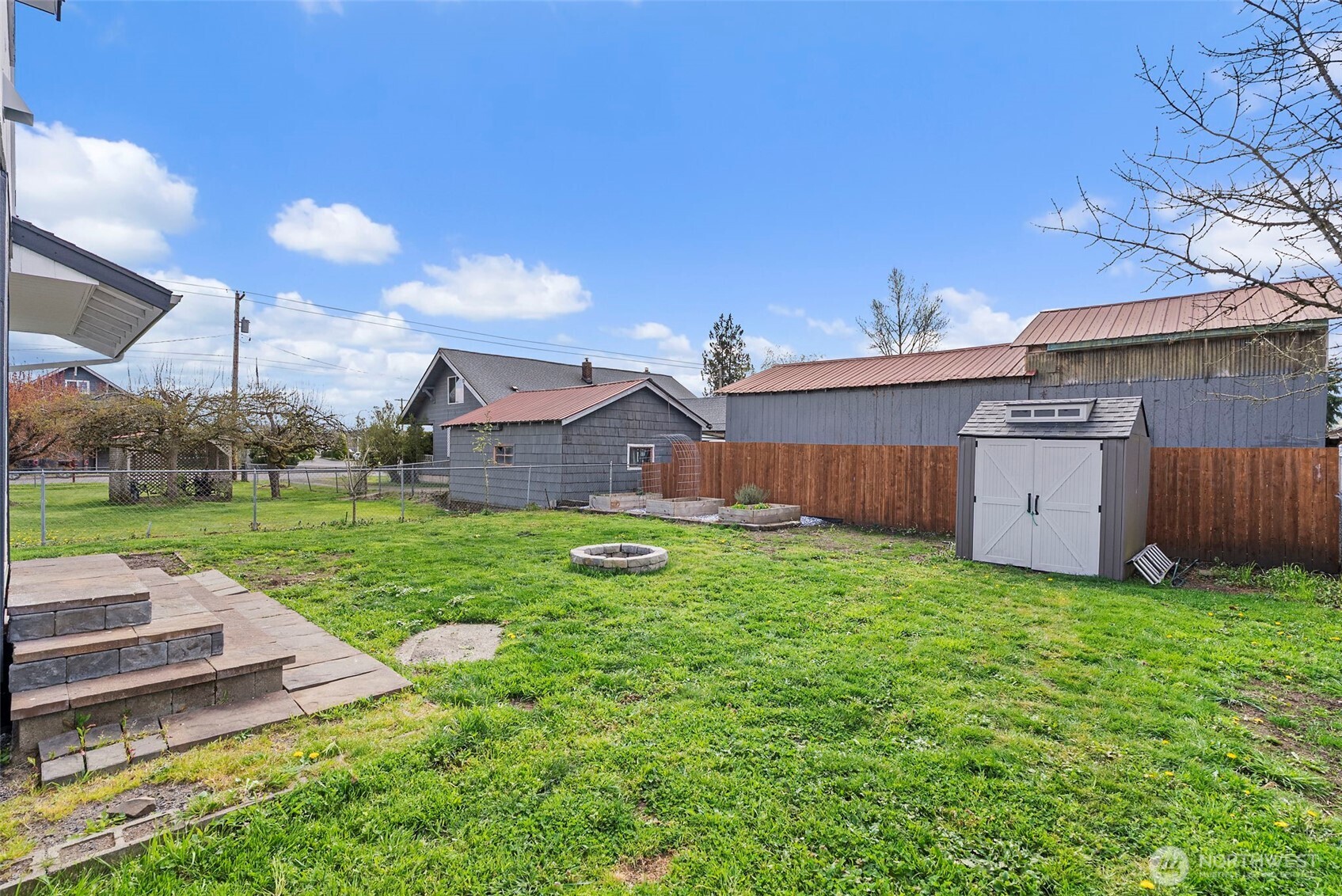 1231 Southwest Elzina Street Chehalis, WA 98532 - Photo 22 of 24 a view of a house with backyard and a garden