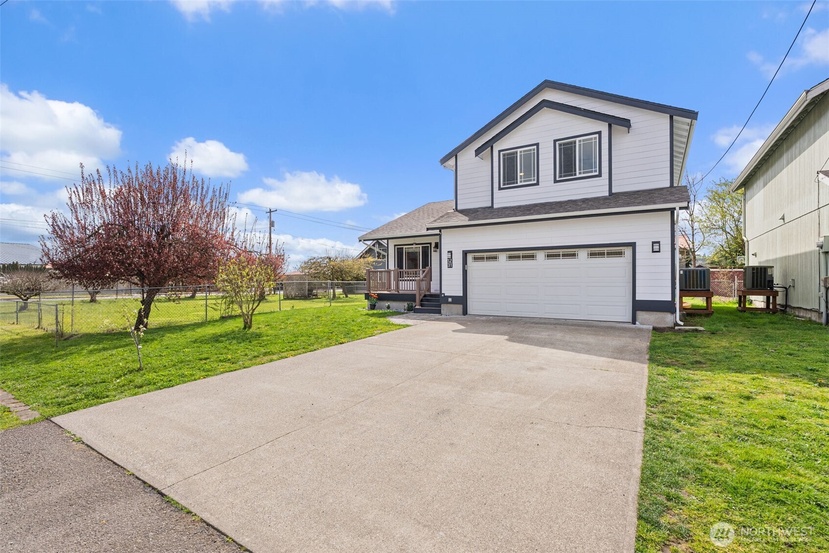 1231 Southwest Elzina Street Chehalis, WA 98532 - Photo 4 of 24 a front view of a house with a yard and garage