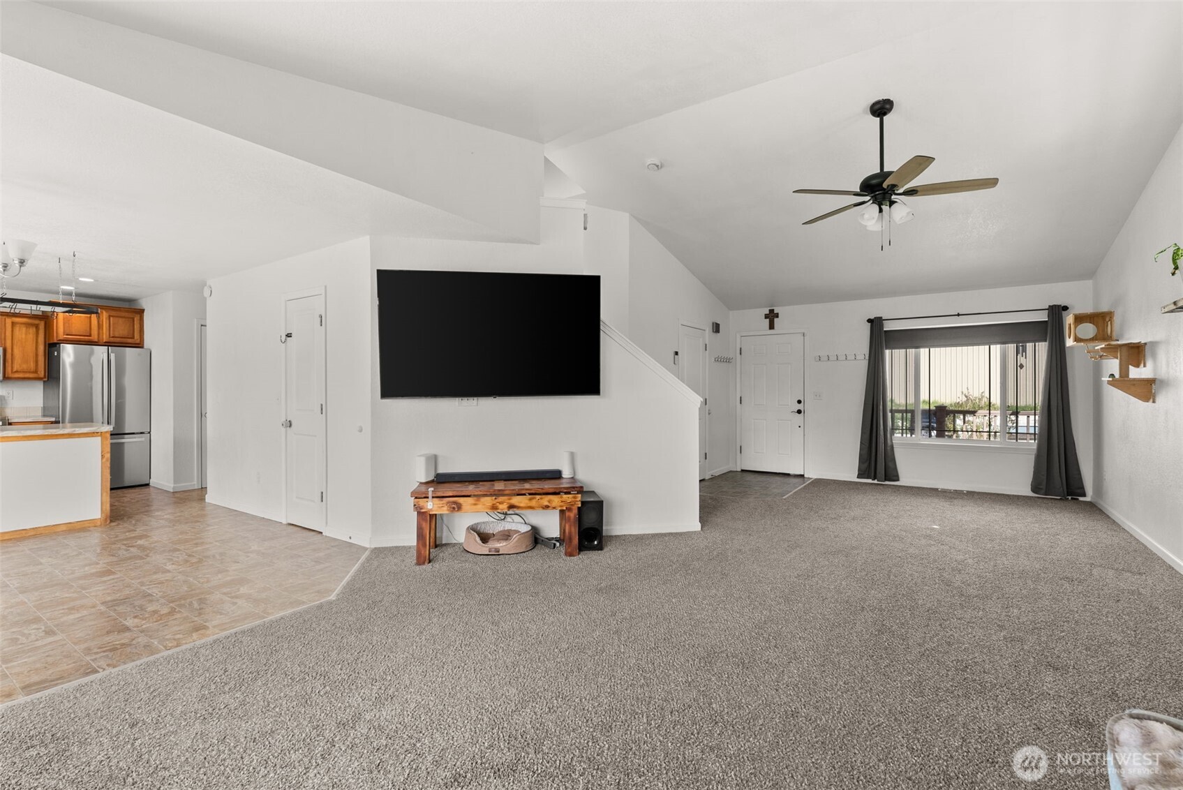 1231 Southwest Elzina Street Chehalis, WA 98532 - Photo 9 of 24 a living room with furniture and a flat screen tv