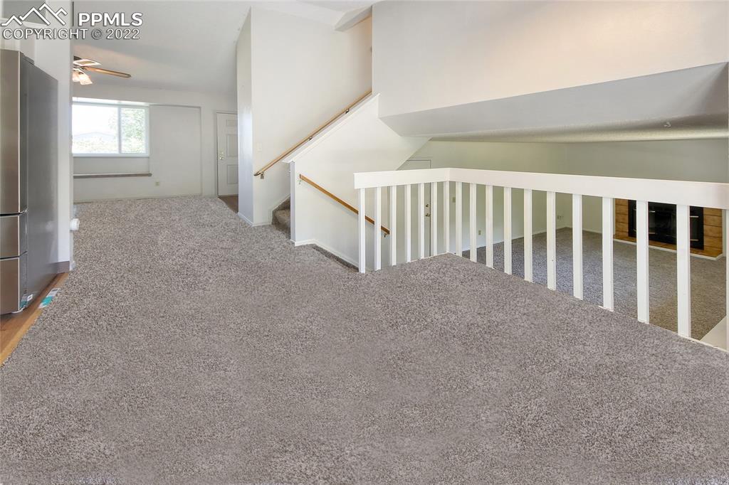 541 Blossom Field Road Fountain, CO 80817 - Photo 11 of 30 a view of a hallway and stairs