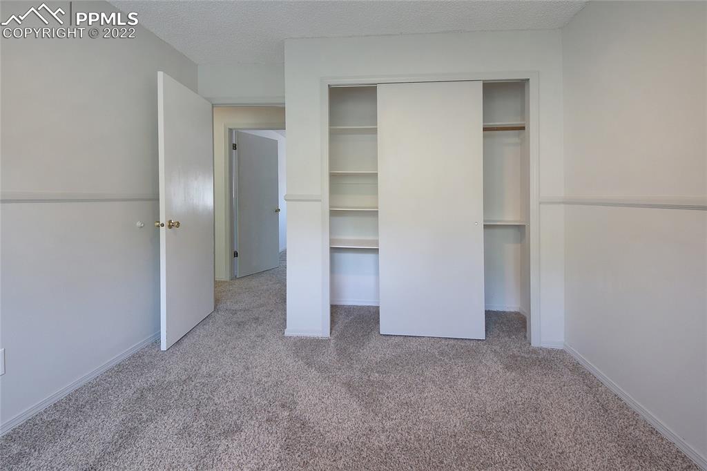541 Blossom Field Road Fountain, CO 80817 - Photo 19 of 30 a view of an empty room and closet area