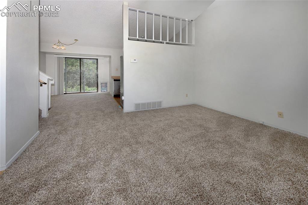 541 Blossom Field Road Fountain, CO 80817 - Photo 2 of 30 a view of an empty room with a window