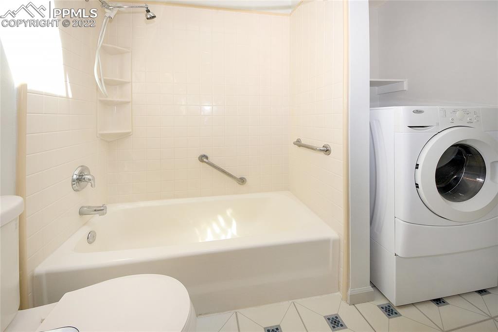 541 Blossom Field Road Fountain, CO 80817 - Photo 21 of 30 a bathroom with a bathtub and a shower