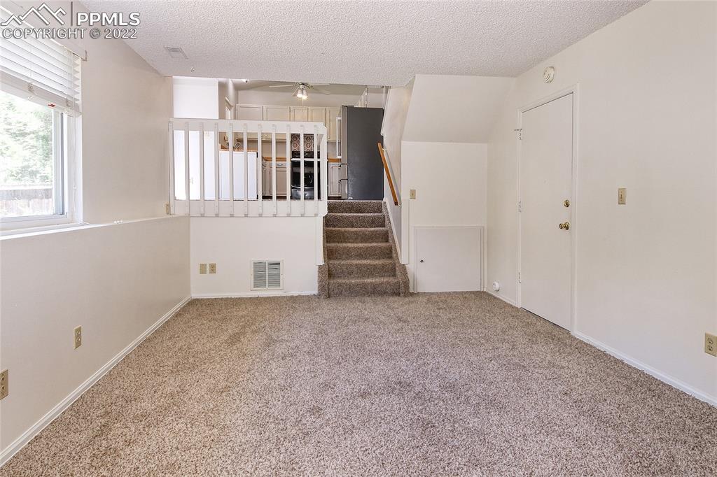 541 Blossom Field Road Fountain, CO 80817 - Photo 23 of 30 an empty room with windows