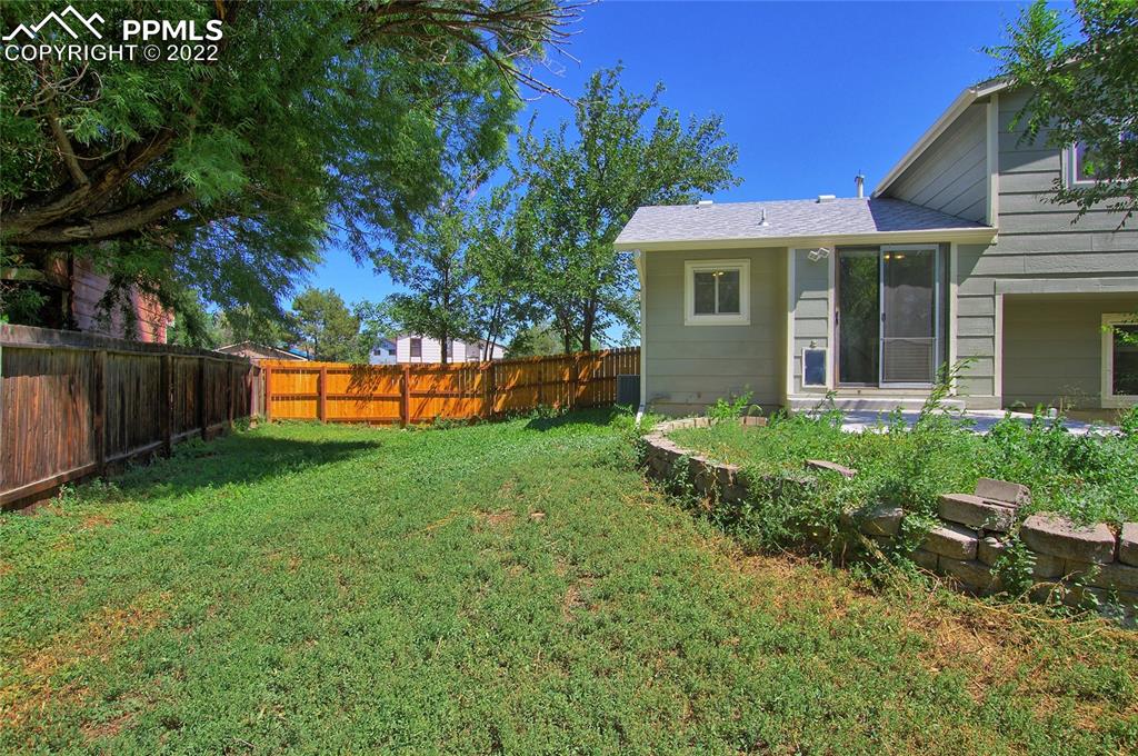 541 Blossom Field Road Fountain, CO 80817 - Photo 25 of 30 a front view of a house with a yard