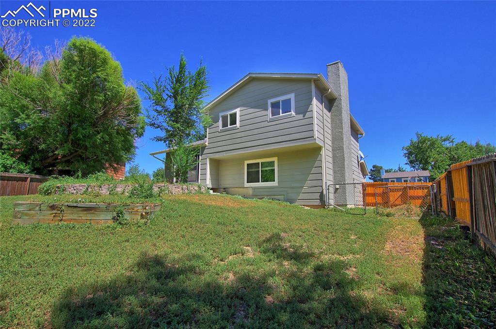 541 Blossom Field Road Fountain, CO 80817 - Photo 28 of 30 a view of a house with a yard