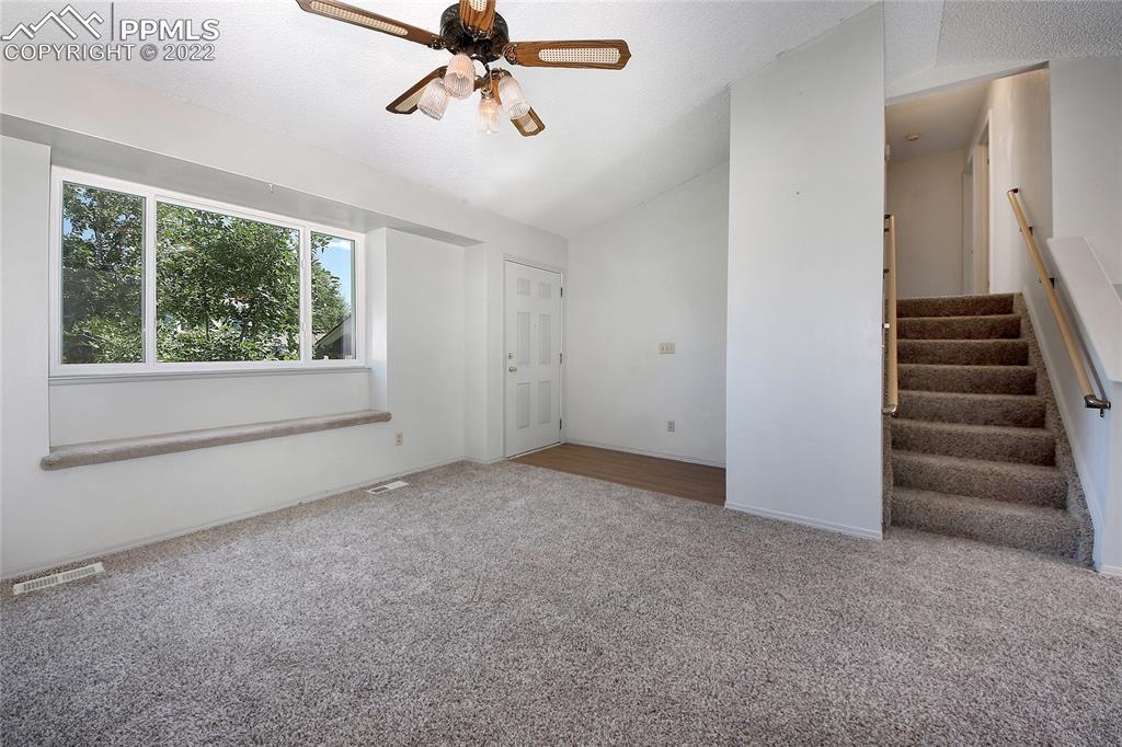 541 Blossom Field Road Fountain, CO 80817 - Photo 4 of 30 a view of an empty room with a window