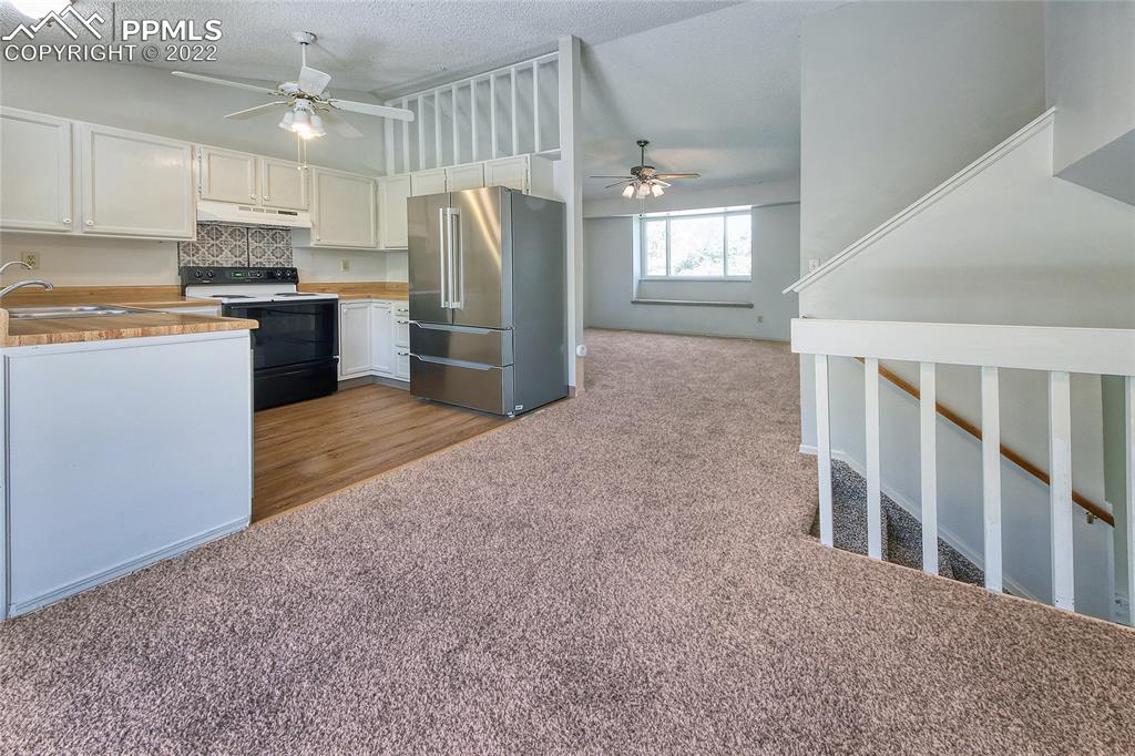 541 Blossom Field Road Fountain, CO 80817 - Photo 10 of 30 a kitchen with refrigerator and window