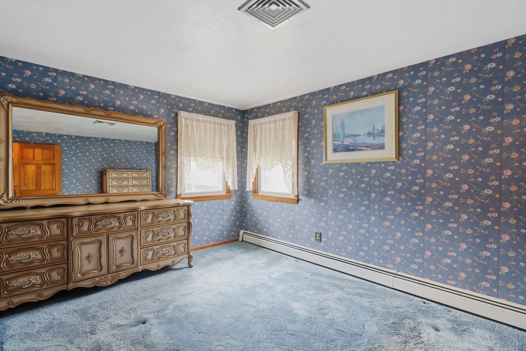 10 Deluca Road Milford, MA 01757 - Photo 22 of 37 a spacious bathroom with a granite countertop sink and a large mirror