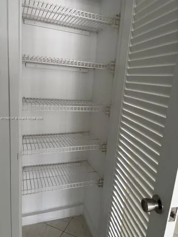 a view of an empty walk in closet