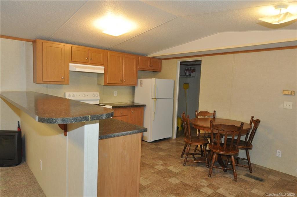 1585 Ashford Road, Unit 2B Chester, SC 29706 - Photo 11 of 15 a kitchen with a table and chairs in it