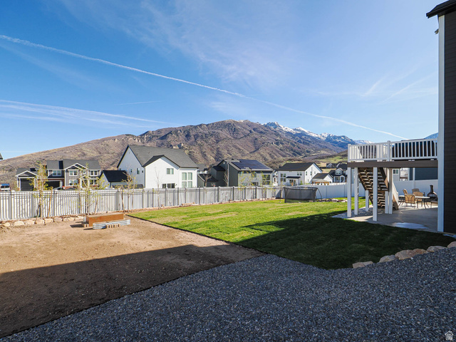 2487 Canyon Wild Road, Unit 413 Draper, UT 84020 - Photo 61 of 75 Fenced backyard featuring a patio area, a residential view, and a deck with mountain view