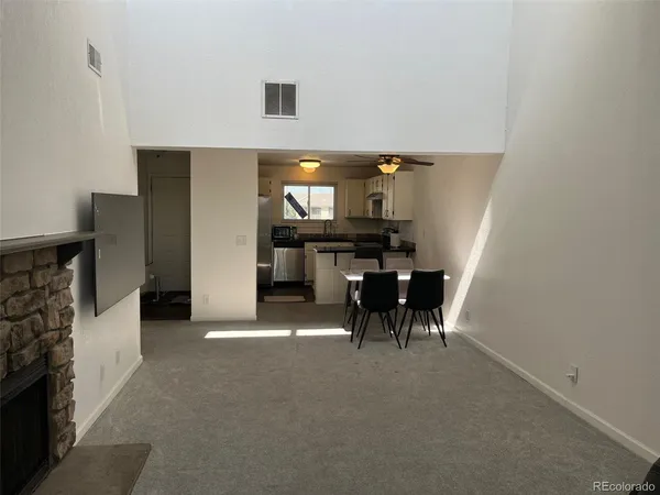a view of a livingroom with furniture and chandelier